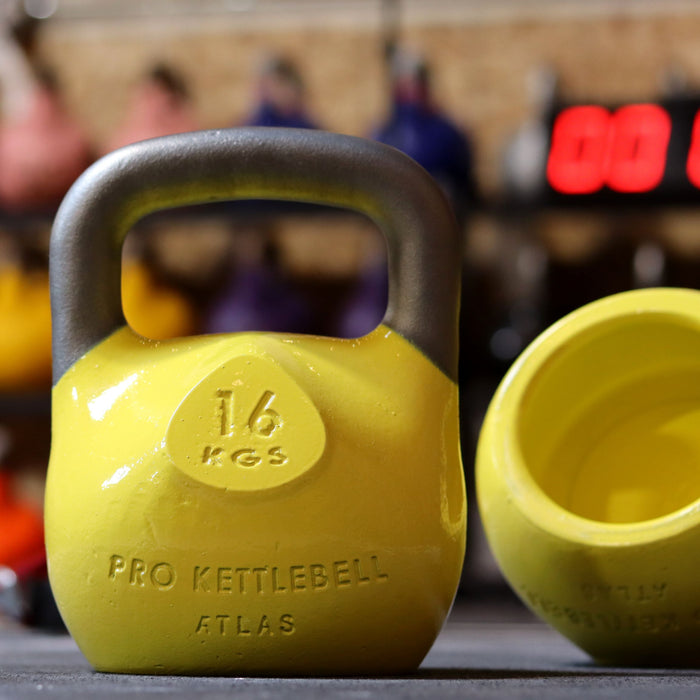 Yellow kettlebells in gym setting