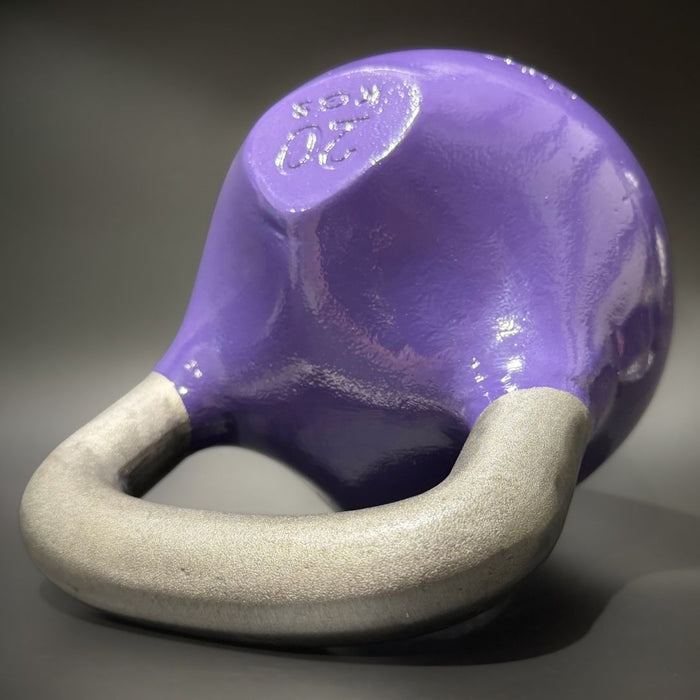 purple kettlebell on black baground
